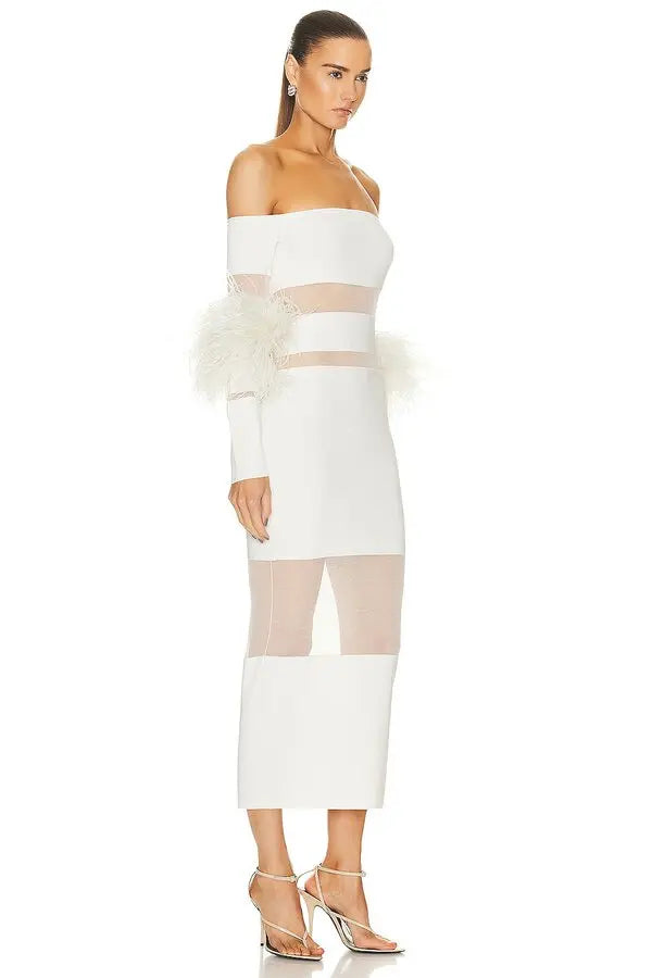 This exquisite Lapointe dress showcases sheer knit panels accented with delicate feather trims, offering a sophisticated textural contrast. The off-shoulder design enhances its elegant silhouette, creating a refined look ideal for special occasions. Crafted from a cotton-viscose blend with intricate intarsia detailing, the dress delivers both comfort and distinctive style.