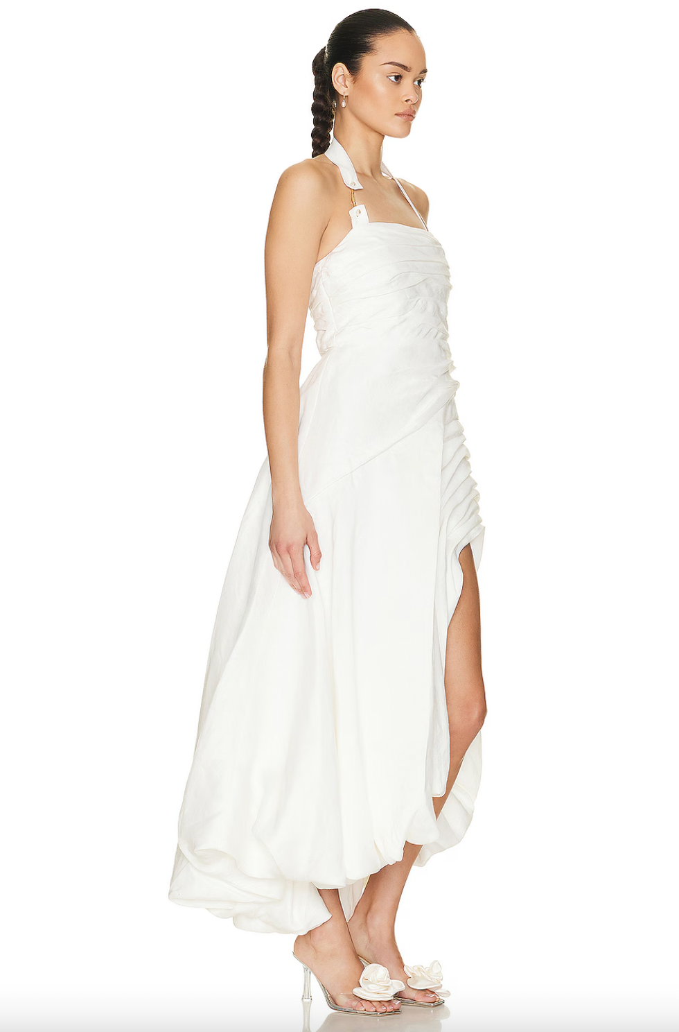 Elevate your wardrobe with the Mika Draped Split Midi Dress by Aje. Made from mid-weight ruched linen and fully lined for comfort, this dress features an asymmetrical hem that moves elegantly with every step. An exposed back zipper offers a contemporary touch, complemented by gold-tone and faux pearl details on the halter-neck strap, creating a sophisticated look ideal for formal occasions. This dress blends timeless design with expert craftsmanship for a polished, refined presence.