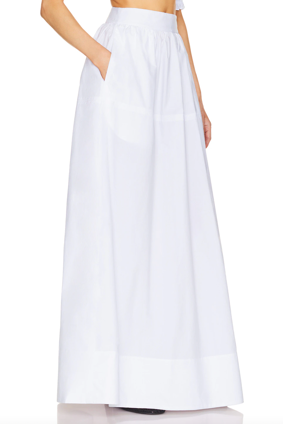 Crafted from 100% cotton lightweight poplin, this maxi skirt offers breathable comfort and a smooth drape. Designed with a hidden side zipper and side slip pockets, it combines practicality with a streamlined silhouette. The unlined construction enhances its light feel, making it ideal for warm weather wear. Note that this item is sold individually, allowing for versatile styling options. Machine washable for easy care, it delivers both function and refined simplicity.