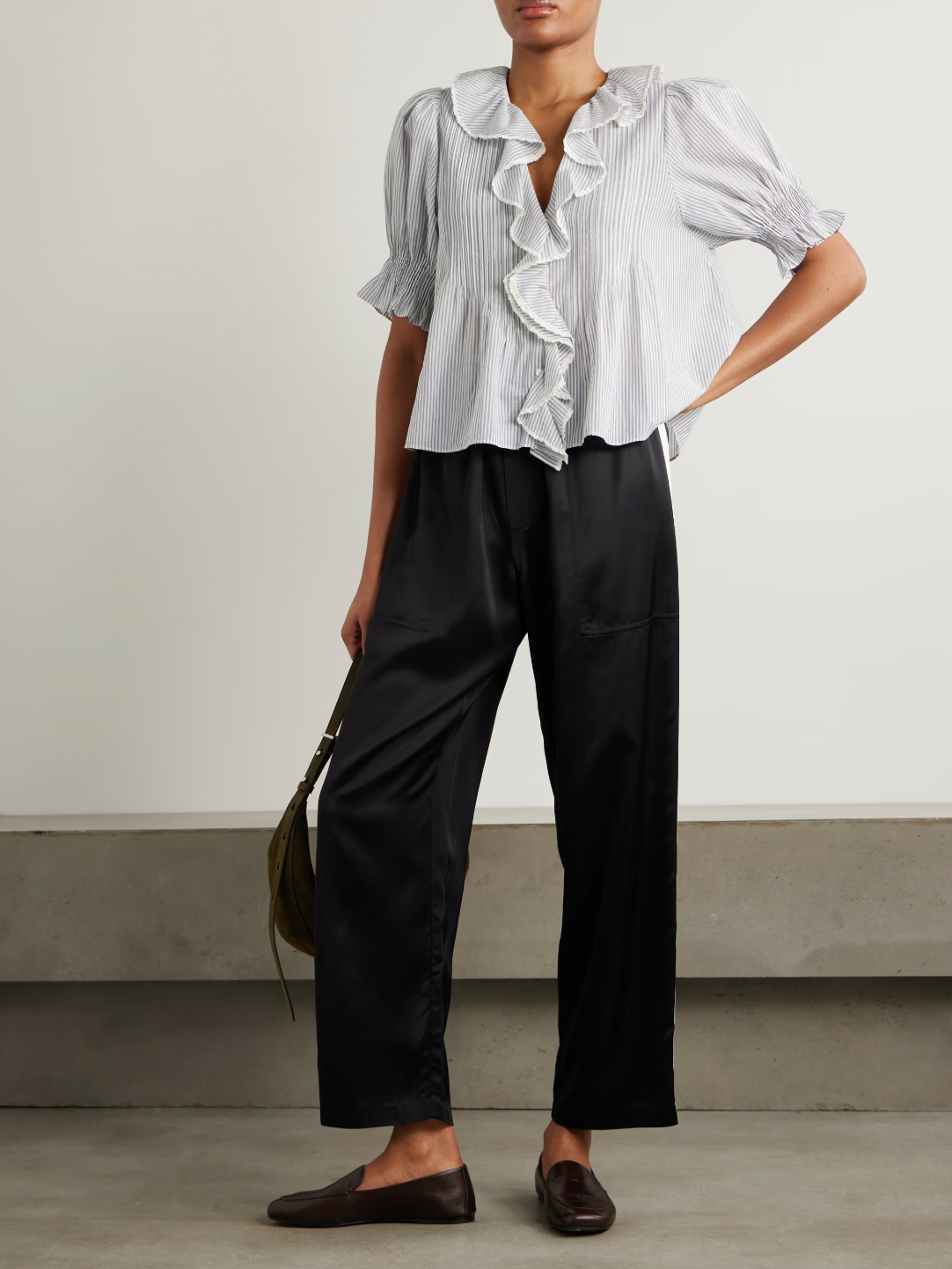 DÔEN's Henri top combines delicate detailing with sustainable craftsmanship. Crafted from organic striped cotton-voile, free from harmful pesticides, it features smocked puffed sleeves and lace-trimmed ruffles that frame the neckline. This top offers a refined, airy silhouette perfect for pairing with straight-leg jeans, balancing comfort with a sophisticated, vintage-inspired aesthetic.