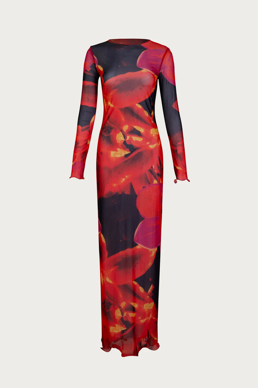 This full-length mesh maxi dress offers a sleek, form-fitting silhouette with its high neckline and long sleeves. Made from sheer, lightweight mesh, it features a unique bold repeat print that varies with each piece. Merrowed ruffle detailing on the sleeves and hem adds elegant sculptural texture. Designed for versatility, this dress effortlessly transitions from daytime sophistication to evening statement wear.