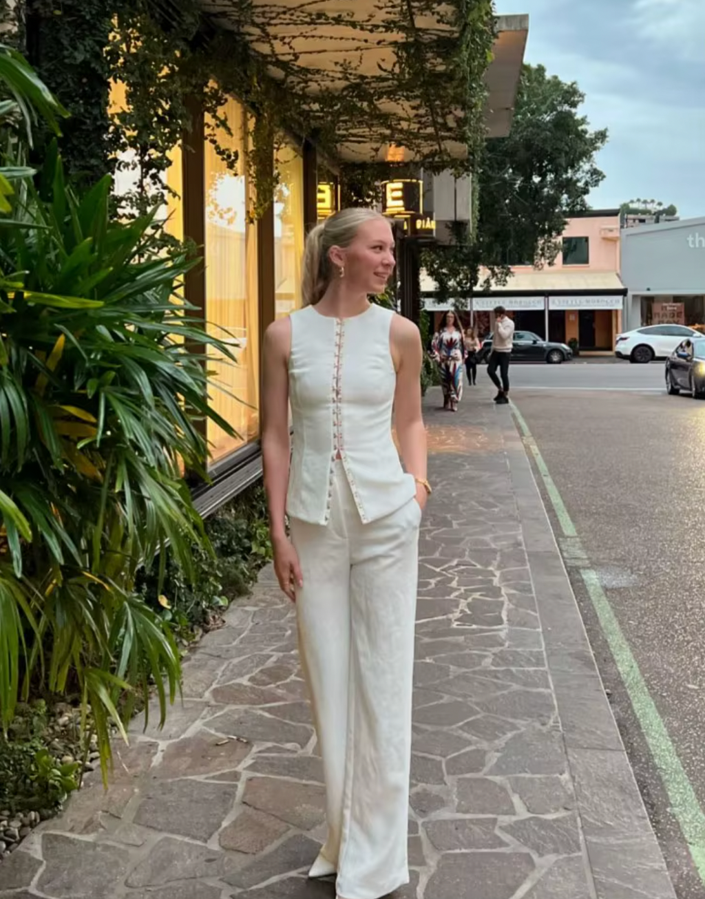 Introducing the Oyster Hook Crew Top, designed to make a statement. Crafted from suiting fabrication. The silhouette features an elegant high neckline and subtly flared hemline. Along with gold hook and eye details that can be adjusted for self styling.