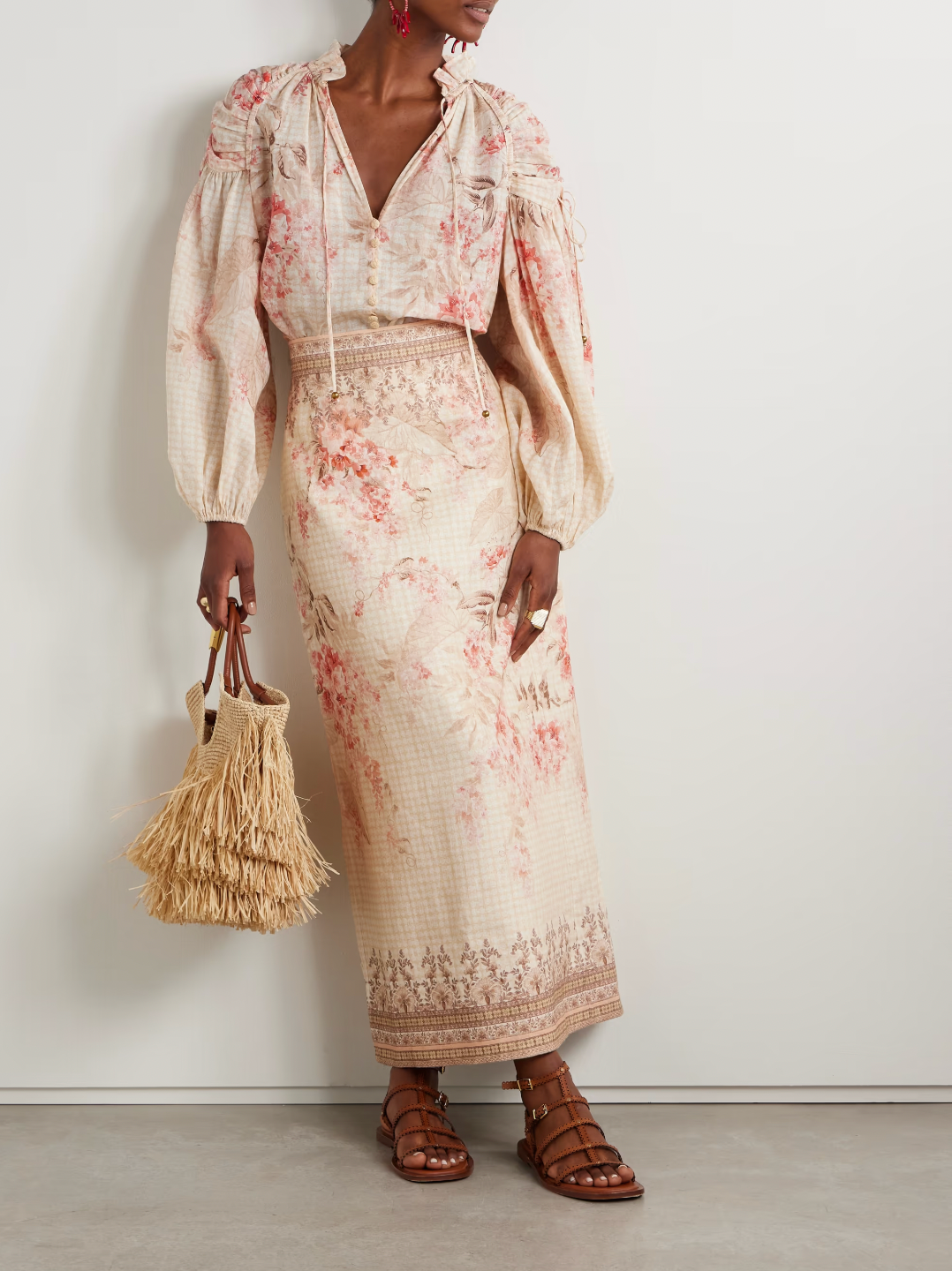 The Illuminate gathered printed ramie blouse by Zimmermann is crafted from breathable ramie fabric, offering natural comfort and durability. Its elegant gathered design enhances silhouette and movement, while the refined print adds a sophisticated touch. Ideal for both casual and dressier occasions, this blouse seamlessly combines airy texture with distinctive style.