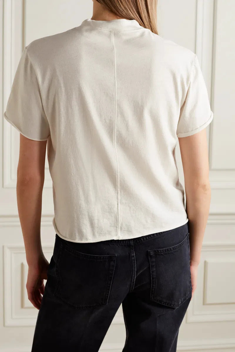 The Fedrino Organic Cotton-Jersey T-Shirt by The Row offers timeless style with exceptional comfort. Crafted from soft organic cotton-jersey, this relaxed-fit tee features dropped shoulders and a slightly wider crewneck for an elevated yet casual look. A subtle back seam adds a refined touch, enhancing its streamlined silhouette. Available in multiple colors, it’s a versatile wardrobe essential designed for enduring wear.