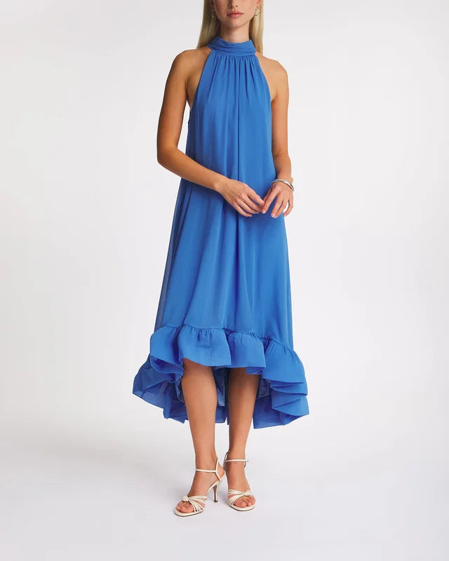 The Dress Sabrina Halterneck Ruffled Maxi by Malina features an elegant halterneck silhouette with a flattering open back. Its ruffled skirt adds movement and charm, while the tie at the neck ensures a customizable and secure fit. Perfect for formal occasions, this dress combines sophistication with feminine detail.
