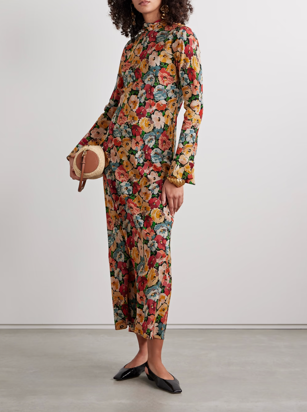 Crafted from washed silk crepe de chine, this dress offers an elegant silhouette through expert tailoring. It features a refined mock neck and dramatic flared sleeves with delicate ruffle-trimmed cuffs. The fitted bodice, paired with an invisible side zipper, transitions smoothly into an ankle-length bias-cut skirt, providing graceful movement. Perfect for those who appreciate timeless style enriched with subtle, sophisticated details.