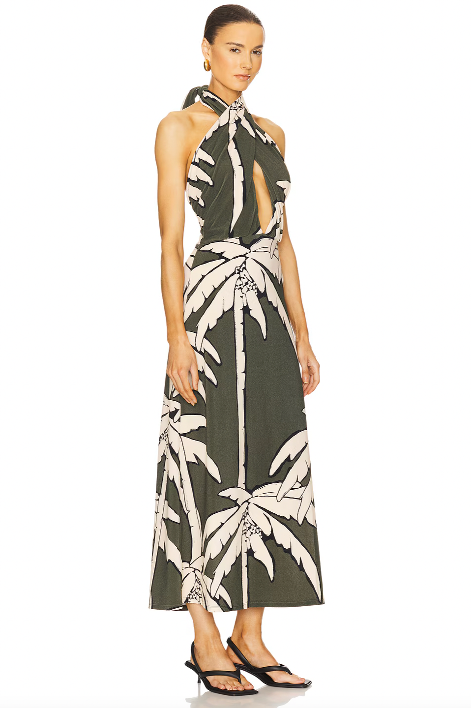 The Oceanic Mantra Ankle Dress by Johanna Ortiz features a partially lined bust for comfortable coverage and support. Its pull-on design with a halterneck tie ensures a customizable fit and easy wear. The distinctive cut-out details add a modern, stylish edge, making it an ideal choice for sophisticated summer occasions.