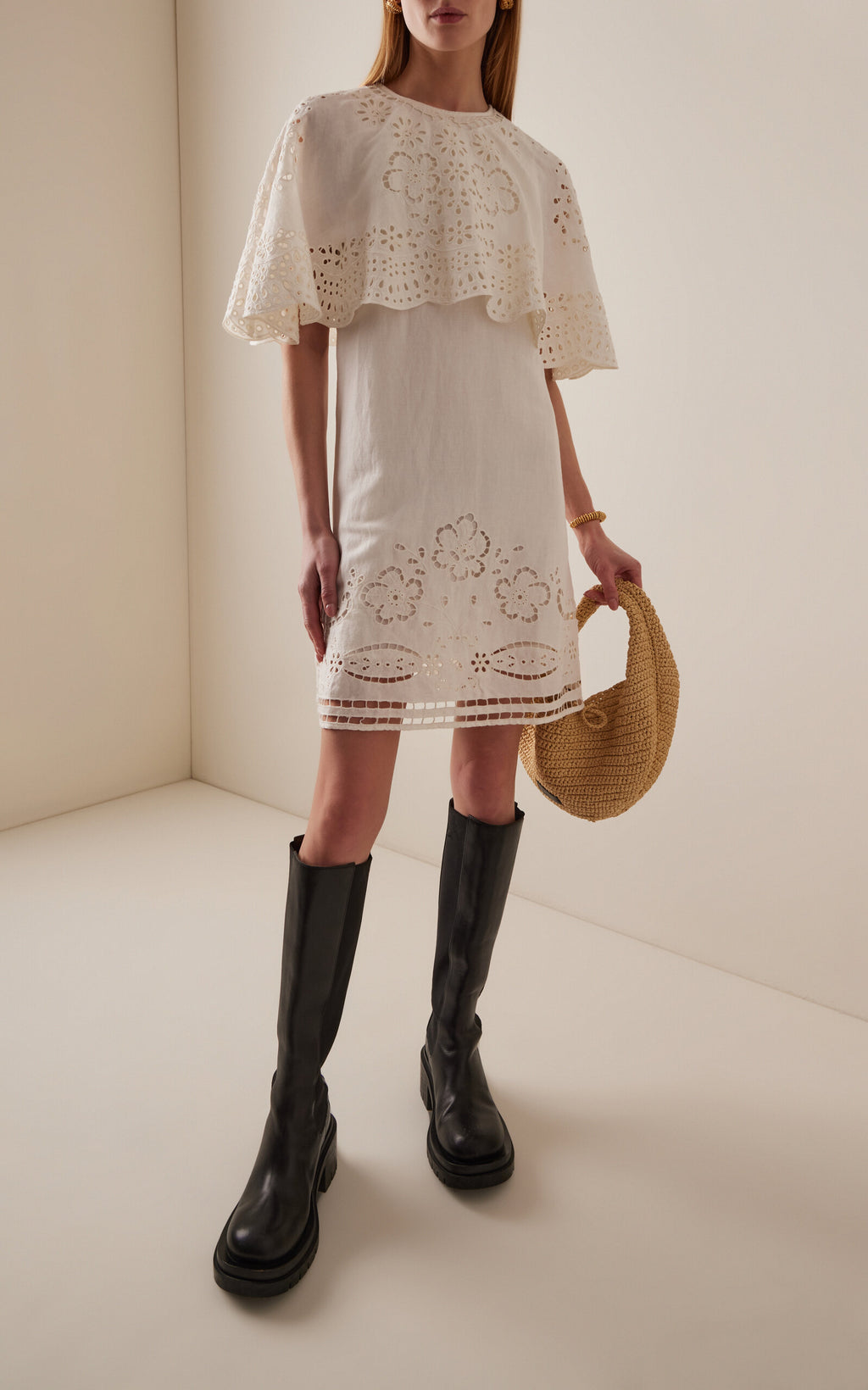 The Lulu Embroidered Linen-Blend Mini Dress by SEA New York combines breathable viscose-linen fabric with delicate eyelet embroidery for a refined texture. Its flouncy capelet adds a sophisticated silhouette, making it an ideal choice for warm-weather occasions where comfort meets understated elegance. This dress offers both lightweight wearability and distinctive design details for a polished, expert look.