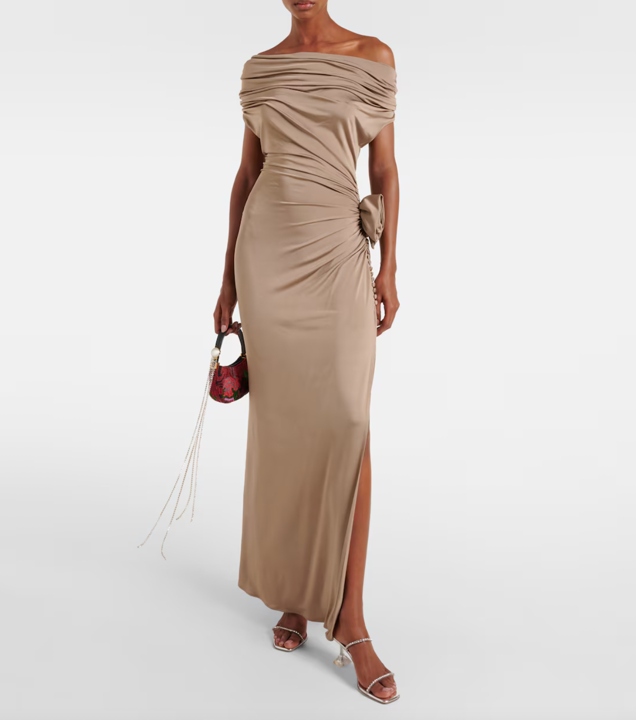 This elegant floral-appliqué jersey midi dress by Magda Butrym combines refined craftsmanship with comfort. The soft jersey fabric ensures a flattering drape and ease of movement, while the intricate floral appliqués add sophisticated textural detail. Perfect for occasions that call for subtle luxury, this dress offers a seamless blend of contemporary design and timeless elegance.