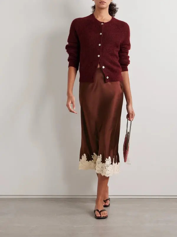The Elowen Lace-Trimmed Silk-Charmeuse Midi Skirt by DÔEN offers a refined silhouette crafted from luxurious silk-charmeuse that gracefully flows with each movement. Its elasticated waistband ensures a comfortable, flattering fit, while the delicate lace trim along the midi-length hem adds an expertly tailored touch of elegance, making it suitable for both sophisticated daytime and evening occasions.