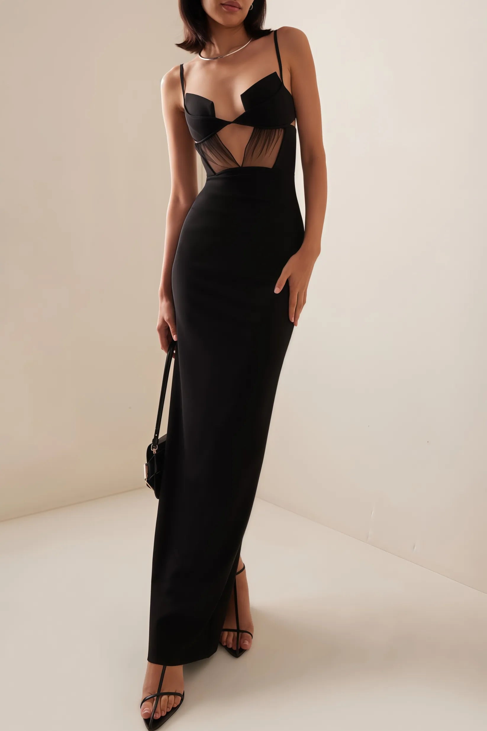 The Crepe Bustier Maxi Dress by Nensi Dojaka elegantly blends modern design with timeless glamour. Featuring a bustier-style top with a keyhole cutout, it accentuates the neckline while sculpting the waist. The fitted bodice flows into a fishtail skirt that hugs the thighs before flaring dramatically, creating an iconic silhouette. Ideal for red carpet events or formal occasions, this dress delivers a refined, high-fashion statement that highlights both sophistication and bold style.