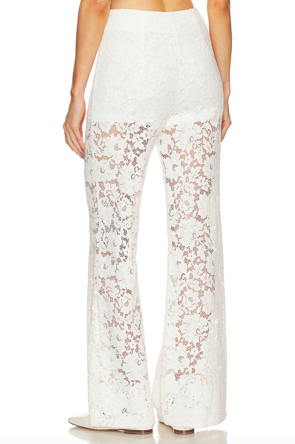 Crafted from a delicate lace fabric blended with cotton, the London Lace Flared Pant offers both elegance and comfort. Featuring a hidden side zipper for a seamless fit, this imported piece requires dry cleaning to maintain its refined texture and shape. Ideal for sophisticated occasions, it combines flattering flare with intricate detailing for a polished look.