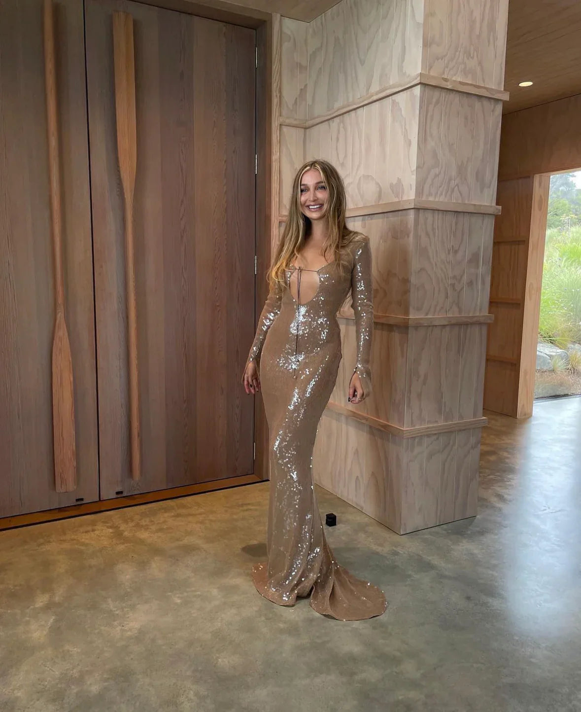 The Solaris Gown in Smoke Sequin showcases a sophisticated keyhole cutout neckline with adjustable drawstring closures at both front and back for a customized fit. Designed with extended sleeves, its slim-fit silhouette includes slight stretch for comfort and ease of movement. The gown slips on effortlessly over the head and is layered with a soft-touch slip to ensure a smooth, itch-free wear experience. Perfect for elegant occasions, it balances striking design with comfort and refined craftsmanship.