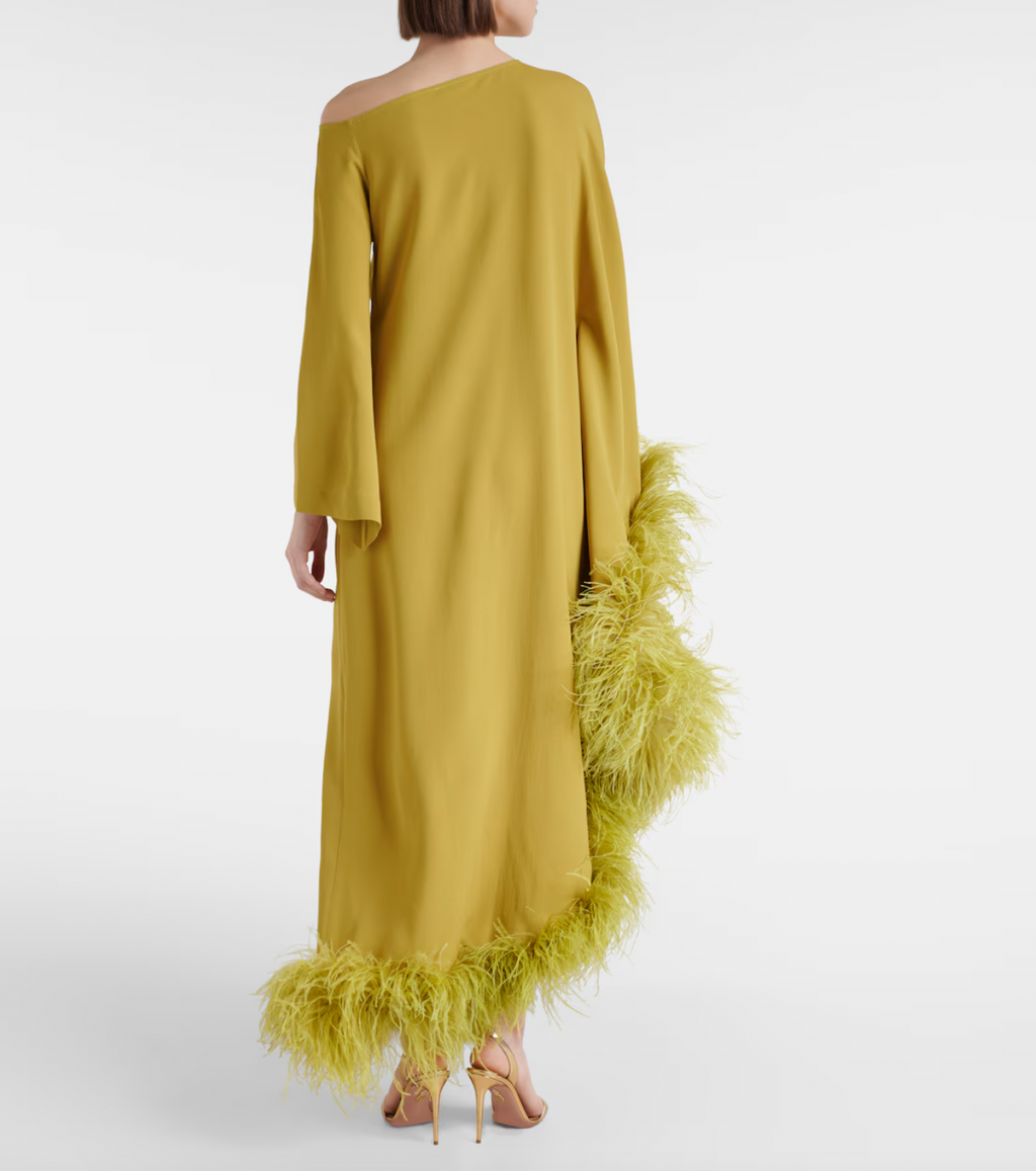 Elevate your formal wardrobe with the Ubud Extravaganza feather-trimmed gown by Taller Marmo. This exquisite dress combines sophisticated tailoring with delicate feather accents, creating an elegant silhouette that commands attention. Ideal for special occasions, it offers a refined balance of texture and movement, ensuring you stand out with effortless grace.
