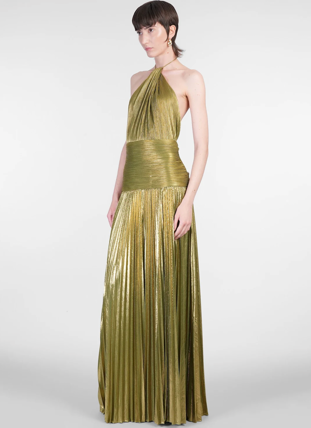 The Thalia Dress by Retrofete showcases pleated satin that shimmers with every movement. Its halterneck tie-up closure and concealed back zipper deliver a tailored fit, complemented by an open back that exudes refined allure. Partially lined for comfort and featuring a front slit, this dress balances elegance with ease of wear, making it a sophisticated choice for any upscale event.