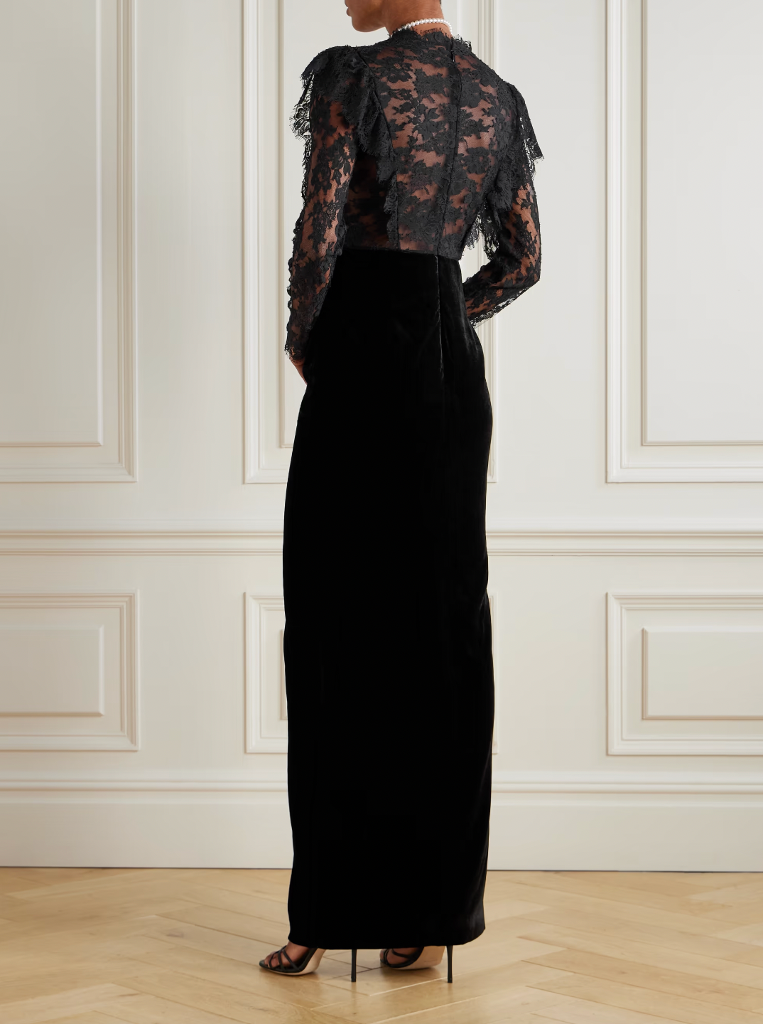 Elevate your evening wardrobe with this exquisite gown from Alessandra Rich. Crafted from sumptuous velvet and delicate lace, this piece seamlessly blends texture and refinement. The signature bow detail adds a touch of feminine elegance, creating a striking focal point that captures attention. Perfect for galas, formal celebrations, or any occasion demanding understated luxury, this gown drapes beautifully to flatter the silhouette while maintaining an air of timeless sophistication.