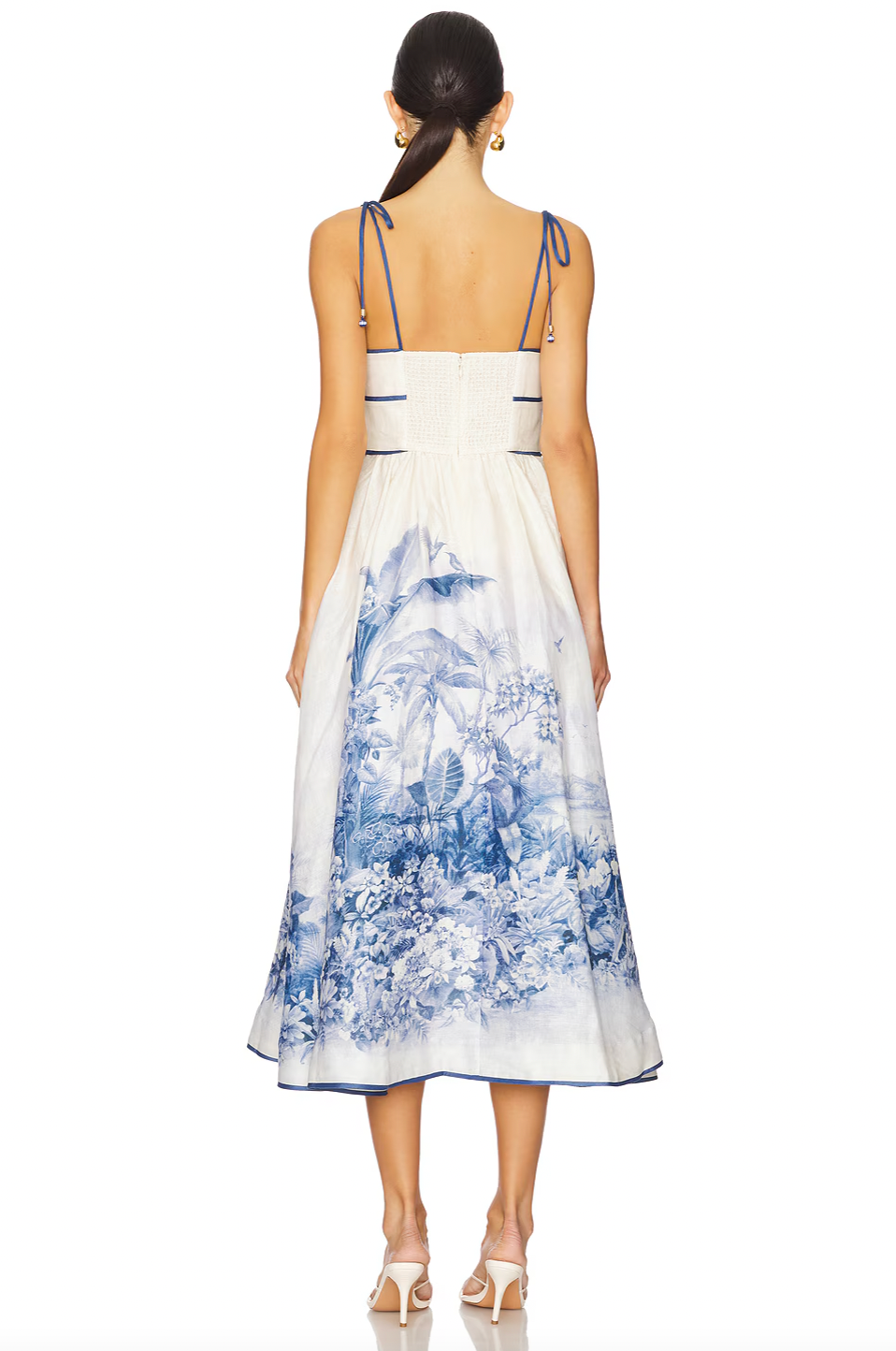 The Wylie Picnic Dress by Zimmermann features a lightweight, non-stretch linen weave ideal for breathable comfort. Its smocked elastic back panel ensures a tailored fit while maintaining ease of movement. Designed with a scoop neck for a classic silhouette, it secures discreetly with a hook-and-eye closure and hidden zip at the back. Practical on-seam side pockets add functionality without compromising style, making it a refined choice for warm-weather occasions.