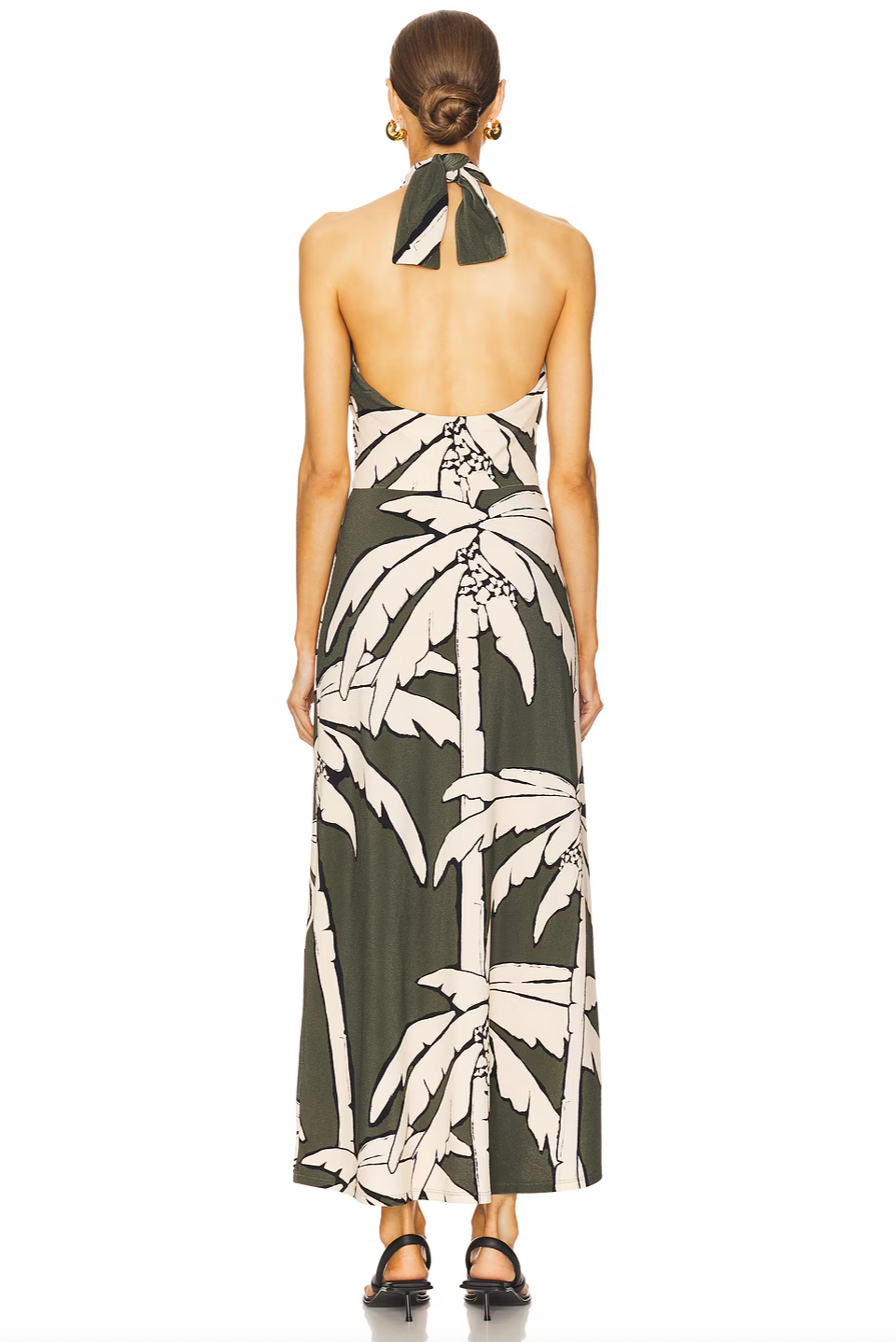 The Oceanic Mantra Ankle Dress by Johanna Ortiz features a partially lined bust for comfortable coverage and support. Its pull-on design with a halterneck tie ensures a customizable fit and easy wear. The distinctive cut-out details add a modern, stylish edge, making it an ideal choice for sophisticated summer occasions.
