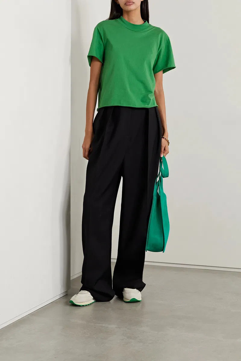 The Fedrino Organic Cotton-Jersey T-Shirt by The Row offers timeless style with exceptional comfort. Crafted from soft organic cotton-jersey, this relaxed-fit tee features dropped shoulders and a slightly wider crewneck for an elevated yet casual look. A subtle back seam adds a refined touch, enhancing its streamlined silhouette. Available in multiple colors, it’s a versatile wardrobe essential designed for enduring wear.