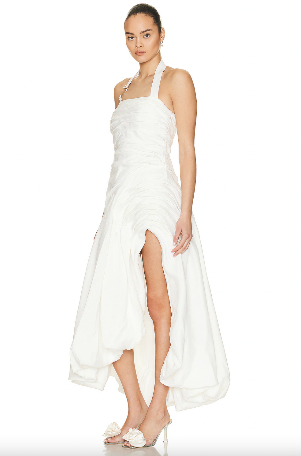 Elevate your wardrobe with the Mika Draped Split Midi Dress by Aje. Made from mid-weight ruched linen and fully lined for comfort, this dress features an asymmetrical hem that moves elegantly with every step. An exposed back zipper offers a contemporary touch, complemented by gold-tone and faux pearl details on the halter-neck strap, creating a sophisticated look ideal for formal occasions. This dress blends timeless design with expert craftsmanship for a polished, refined presence.