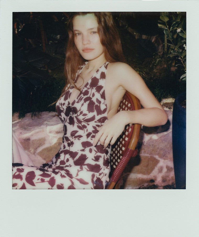 The Simone in Chocolate Havana offers an ankle-length silhouette that flatters with a captivating bust line, perfect for embracing late summer elegance. Crafted from smooth silk in a timeless chocolate brown and white Havana print, this dress requires minimal styling—no bra needed. Whether worn with hair up or down, its effortless charm is complemented by subtle jewelry. Experience an endless summer escape in the refined yet relaxed design of the Simone.
