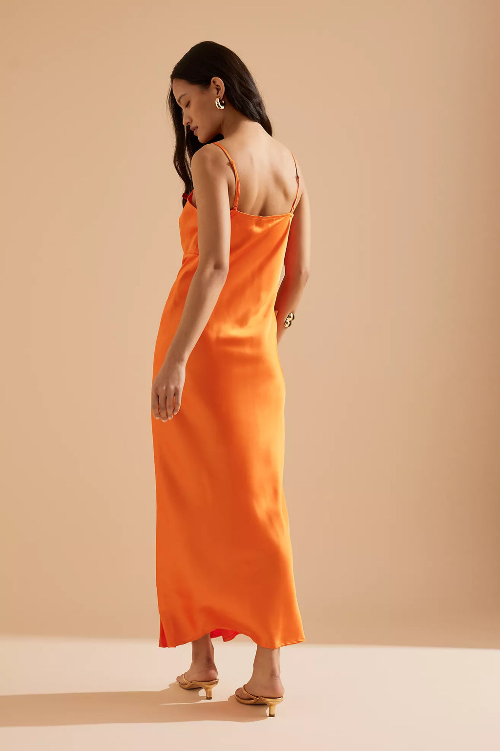 Elevate your ensemble with the Caetana dress, expertly designed to flatter with adjustable shoulder straps and a deep V-neck that accentuates your shape. The scalloped eyelash lace trim and side splits at the hem introduce delicate femininity and fluid movement, ensuring a poised and captivating presence at any occasion.