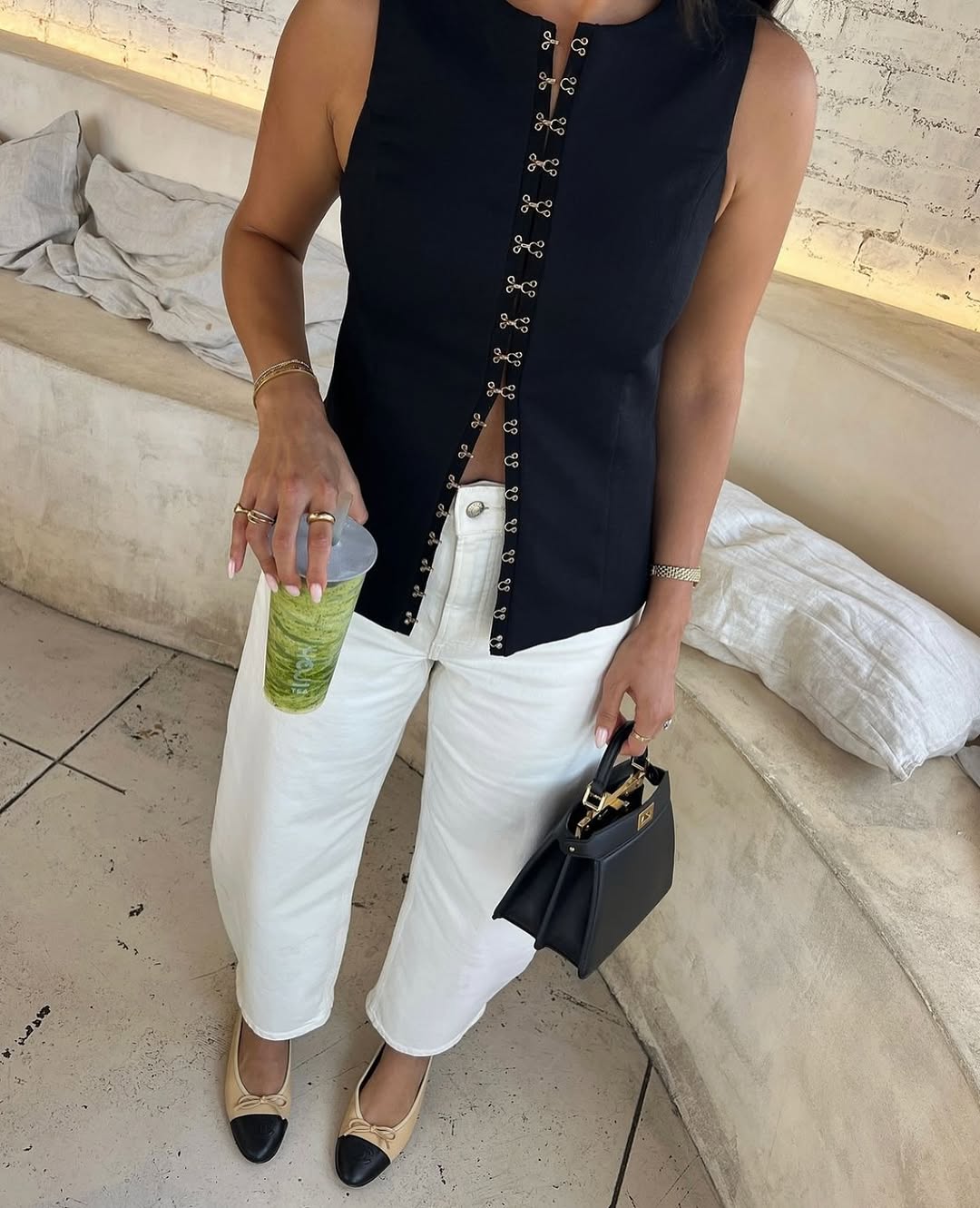 Elevate your fashion game with the Oyster Hook Crew Top in Black. Made from luxurious suiting fabric, this top boasts a sophisticated high neckline and flattering flared hemline. The adjustable gold hook and eye details add a touch of elegance and allow for customizable styling. Make a statement with this must-have piece.