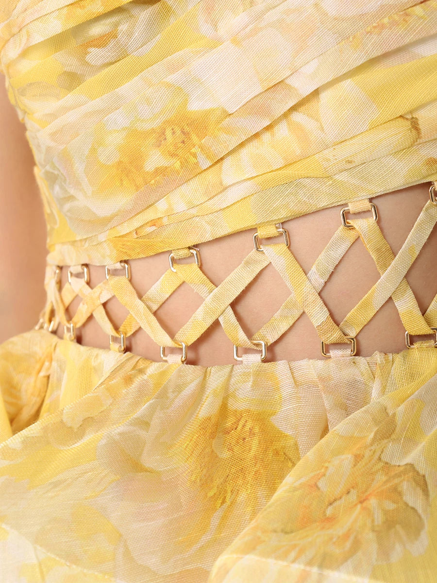 The Iris Dress by YVON is crafted from premium linen silk, showcasing an elegant yellow blend with a floral print inspired by fairy forest blossoms. Its handmade asymmetrical bodice defines femininity with subtle allure, while the waist lacing sculpts a striking silhouette. This dress balances romantic charm with sophisticated design for a truly unique statement piece.