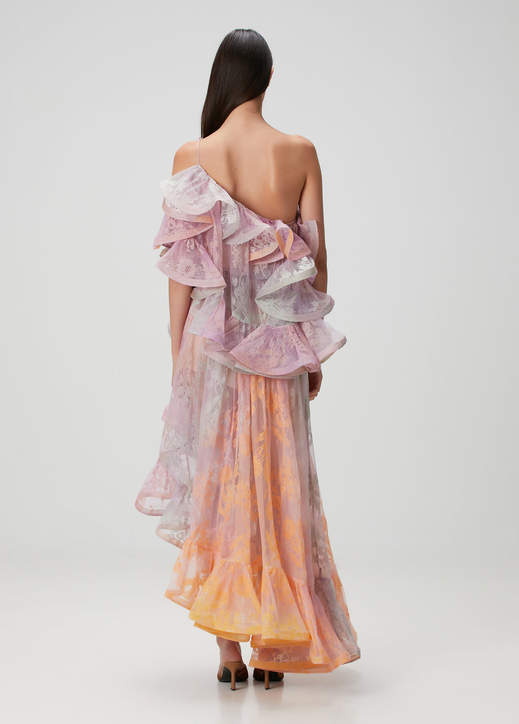 This elegant maxi dress features a distinctive one-shoulder design with an asymmetric neckline that adds a modern touch. Crafted from delicate lace, it offers a refined texture enhanced by flounced detailing and a laced shoulder strap for added sophistication. Perfect for formal occasions, its flowing silhouette ensures graceful movement while highlighting your poise and style.