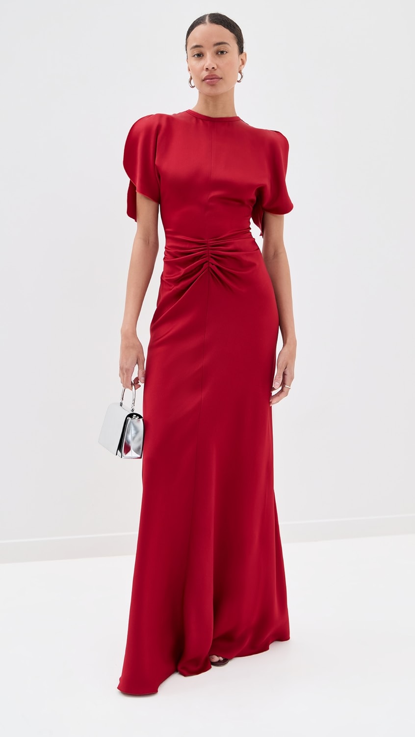 Elegant and refined, this floor-length dress by Victoria Beckham features luxurious mid-weight charmeuse that drapes beautifully without stretch. Strategic ruching at the waist creates a flattering silhouette while the crew neckline and short sleeves offer timeless sophistication. The hidden zip and hook-and-eye closure at the back ensure a seamless finish. Perfect for formal occasions and evening events where polished elegance is paramount.