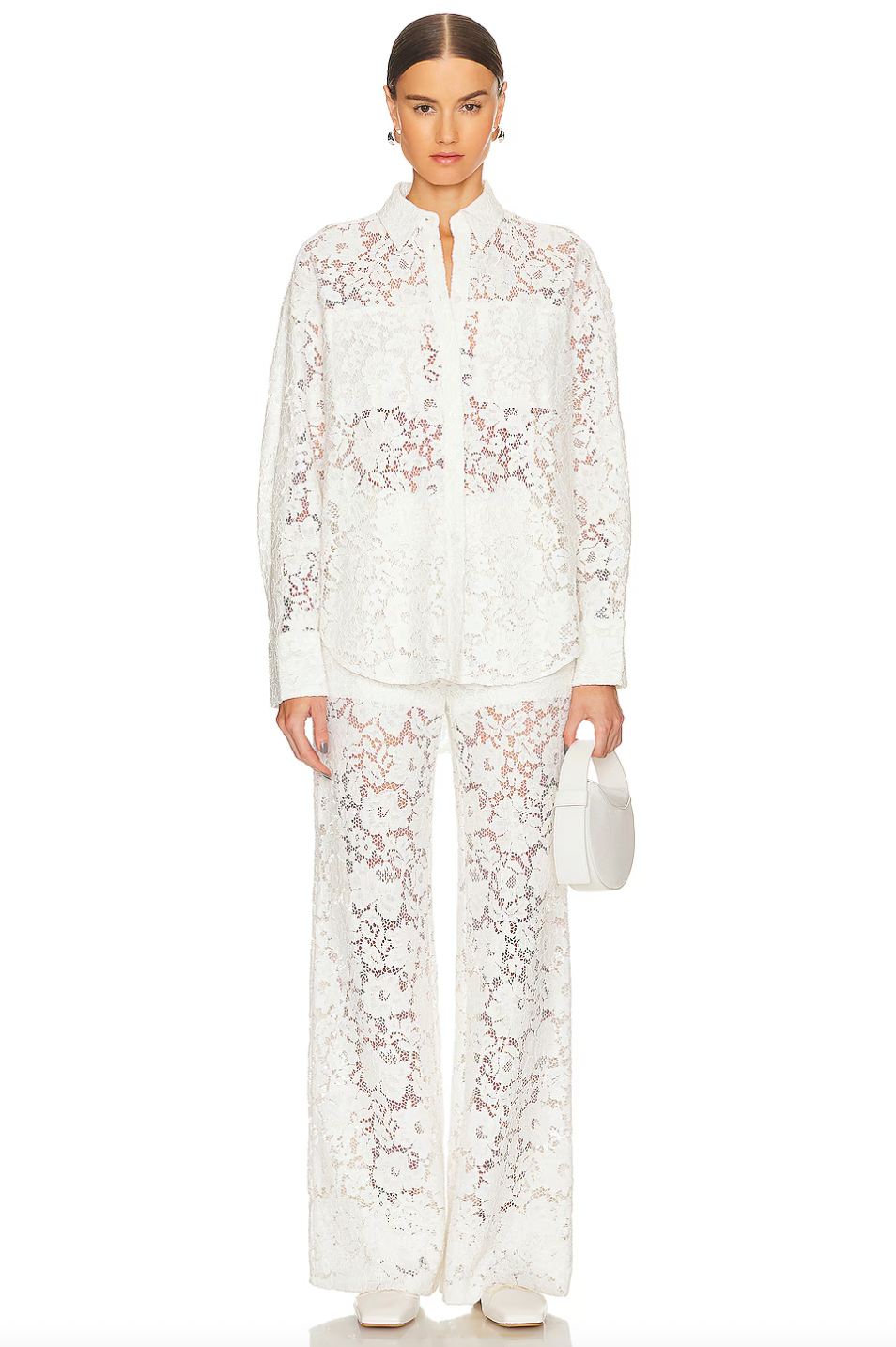 Crafted from a delicate lace fabric blended with cotton, the London Lace Flared Pant offers both elegance and comfort. Featuring a hidden side zipper for a seamless fit, this imported piece requires dry cleaning to maintain its refined texture and shape. Ideal for sophisticated occasions, it combines flattering flare with intricate detailing for a polished look.