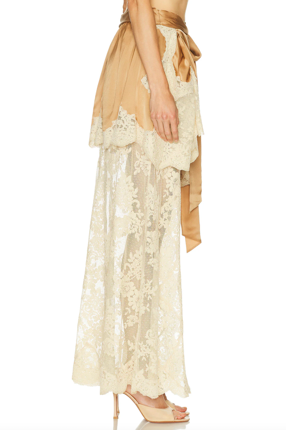 Crafted from midweight satin, the Hypnotic Satin Drape Skirt by Zimmermann features a refined asymmetrical hem accented with delicate lace trim for subtle elegance. Its partially lined design ensures comfort and movement, while a hidden back zip closure offers a sleek silhouette. The detachable belt with a front tie allows for versatile styling, making this skirt a sophisticated addition to any wardrobe. Please note, the piece is sold separately and not as a set.