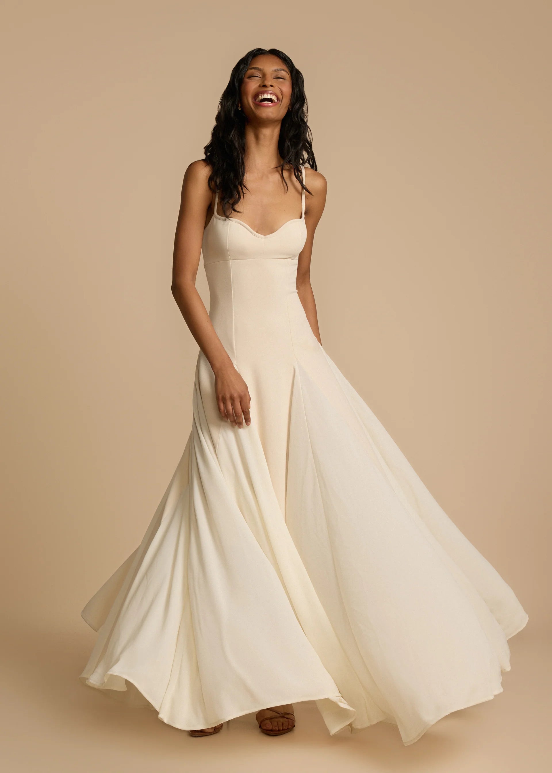 Paloma Dress by Arcina Ori combines classic elegance with modern design, featuring a paneled A-line skirt crafted from white georgette that drapes smoothly off the hips and moves gracefully. Its contrasting accents enhance fluidity, making it ideal for memorable occasions. Equipped with padded bra cups and binded edges, it offers structured support and a flattering silhouette. Paloma delivers refined sophistication and confidence from every perspective.