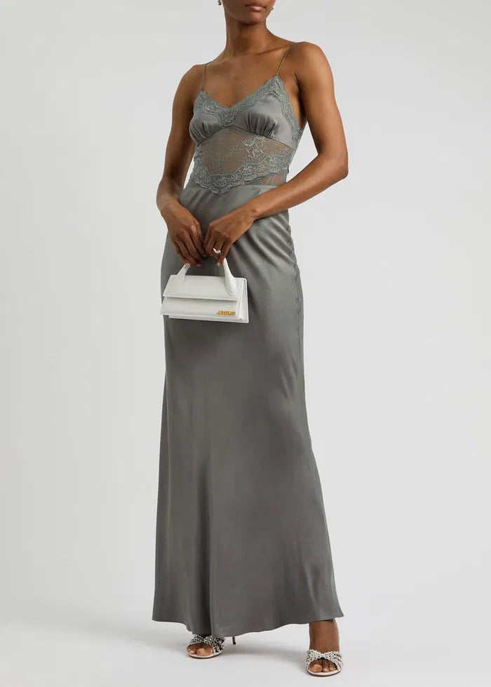 The Amoras Lace-Trimmed Satin Maxi Slip Dress exemplifies sophisticated contemporary design. Its smooth satin fabric drapes elegantly in a flattering maxi silhouette, enhanced by delicate lace trim to add refinement. Perfect for occasions requiring understated luxury, this dress seamlessly blends modern style with timeless elegance, embodying the confident color palette and sleek tailoring signature to its Australian heritage.