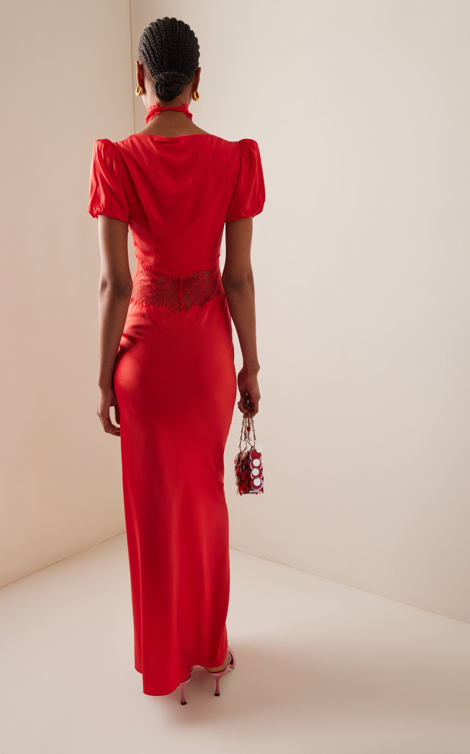 The Pavlova Lace-Trimmed Silk-Blend Maxi Dress from De La Vali channels the spirit of muse Vali Myers through its elegant design. Crafted from a luxurious silk blend, this maxi dress features delicate lace trimming that adds a refined touch. Its flowing silhouette empowers the wearer with effortless confidence, making it a statement piece that combines artistry with wearable sophistication. Perfect for those who embrace bold elegance with a bohemian edge.