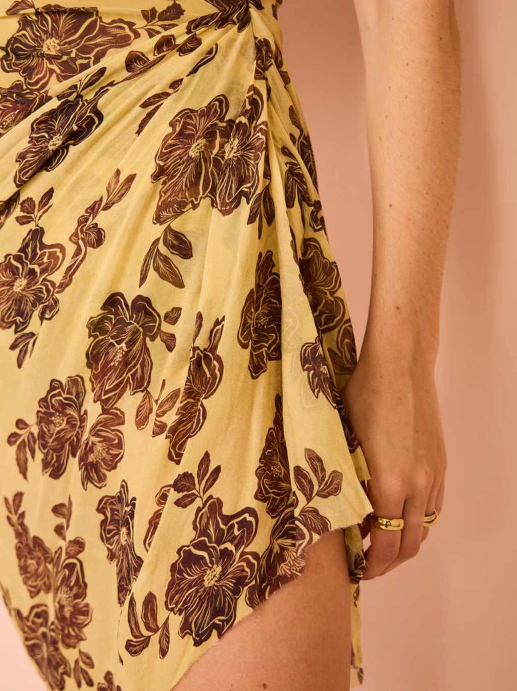 Elevate your style with the Malibu Bay Draped Mini Dress from Bec & Bridge. Made with luxurious sheer fabric, this dress boasts a straight neckline and asymmetrical skirt, offering versatility with a detachable rouleau halter tie. Perfect for any summer or party occasion, experience sophistication and grandeur with this elegant dress.