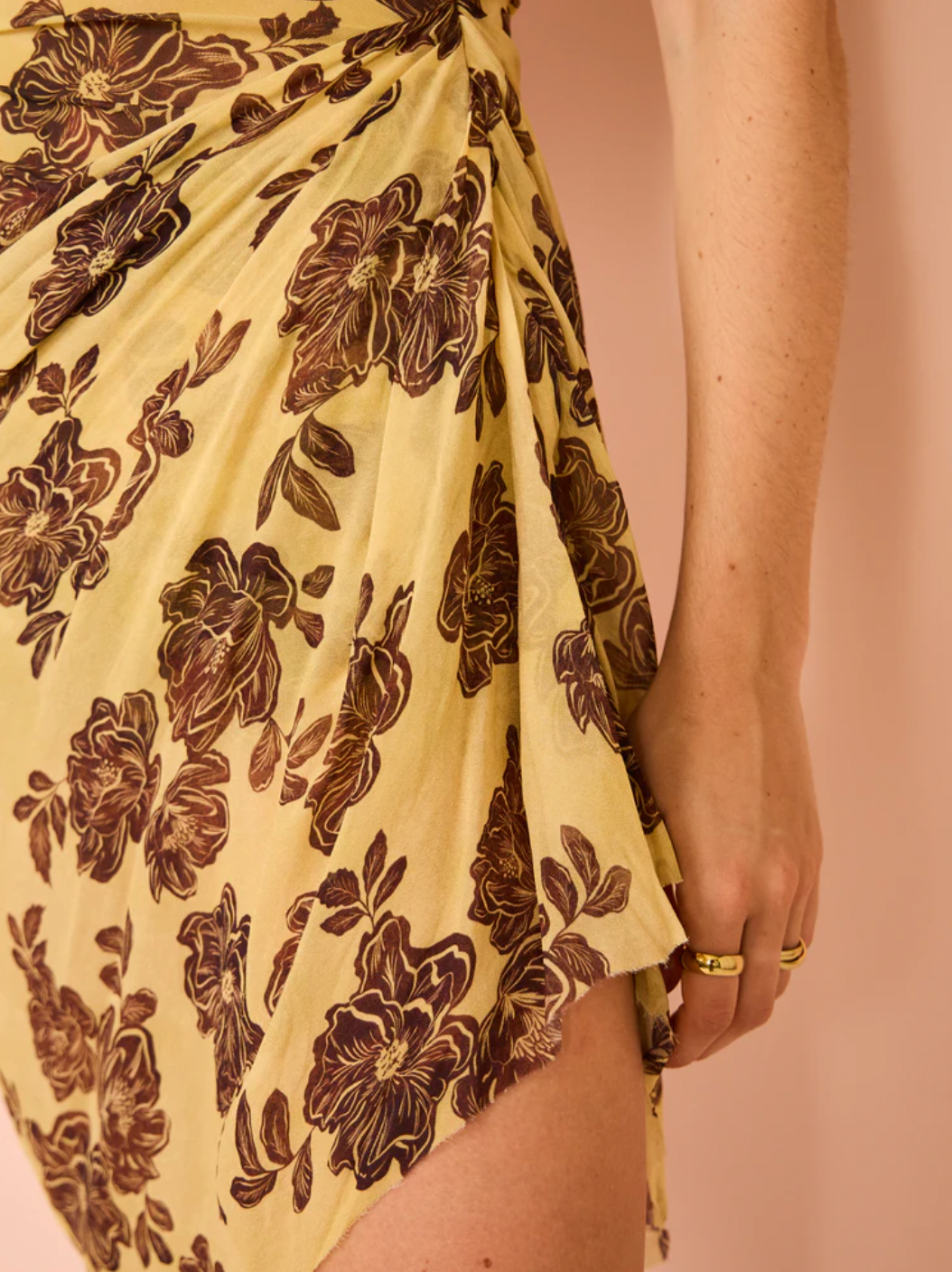 Elevate your style with the Malibu Bay Draped Mini Dress from Bec & Bridge. Made with luxurious sheer fabric, this dress boasts a straight neckline and asymmetrical skirt, offering versatility with a detachable rouleau halter tie. Perfect for any summer or party occasion, experience sophistication and grandeur with this elegant dress.