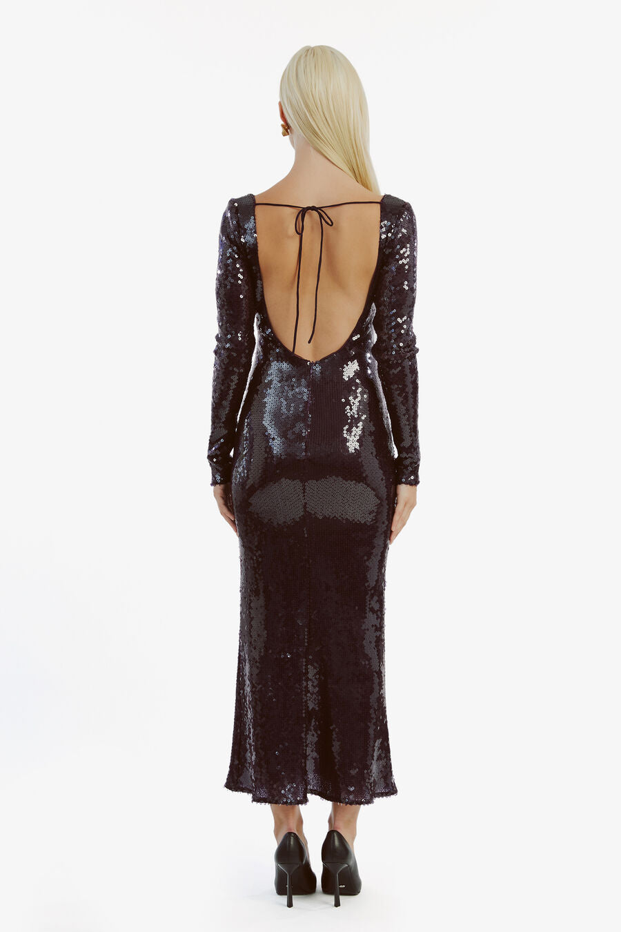 The Verona Sequin Maxi Dress commands attention with its dazzling fully sequined design. Expertly tailored, it features a low scoop neckline, a striking front keyhole, and a sultry open back, combining elegance with a bold, modern edge. Perfect for making a memorable impression at any evening event.