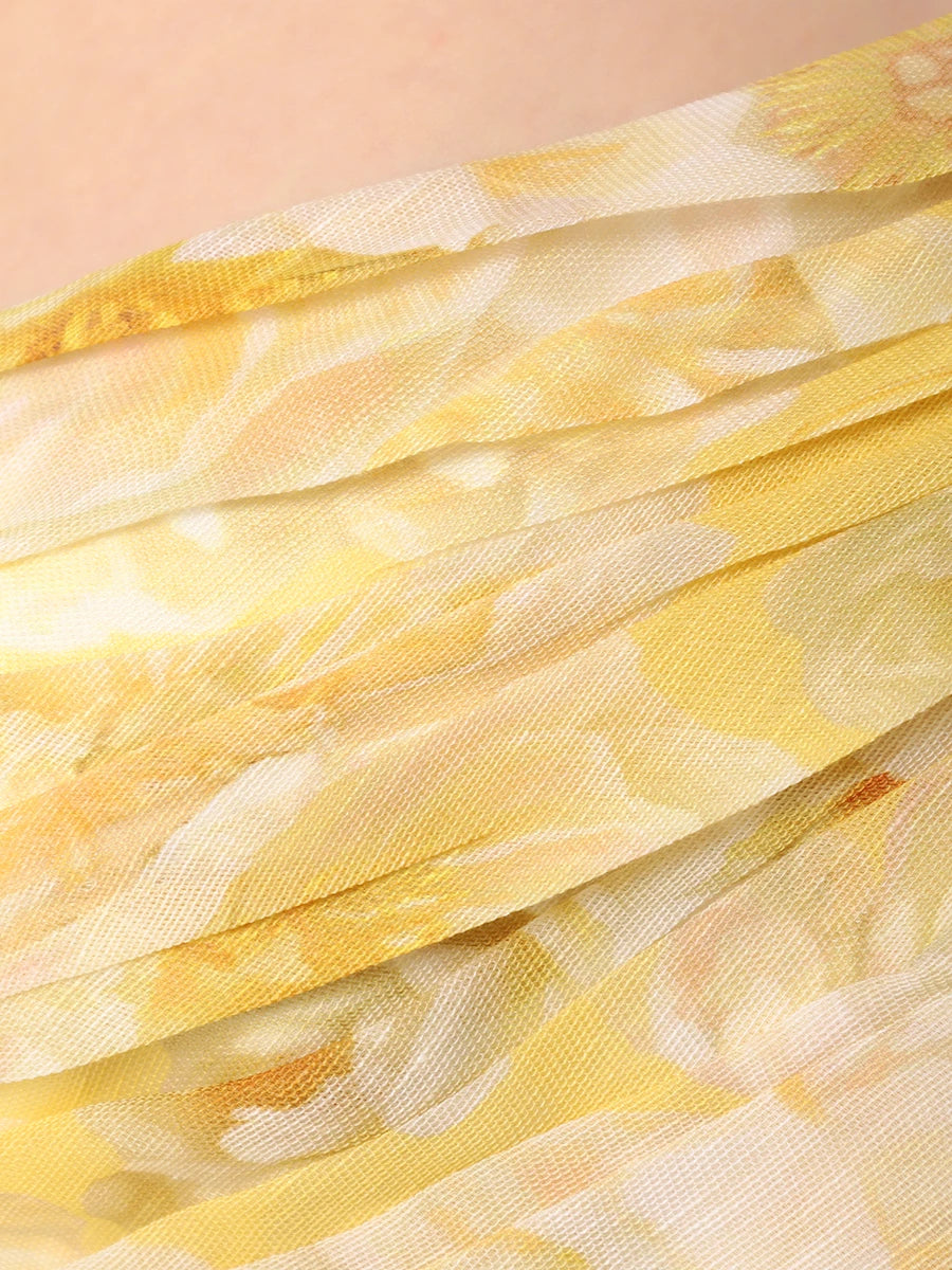 The Iris Dress by YVON is crafted from premium linen silk, showcasing an elegant yellow blend with a floral print inspired by fairy forest blossoms. Its handmade asymmetrical bodice defines femininity with subtle allure, while the waist lacing sculpts a striking silhouette. This dress balances romantic charm with sophisticated design for a truly unique statement piece.