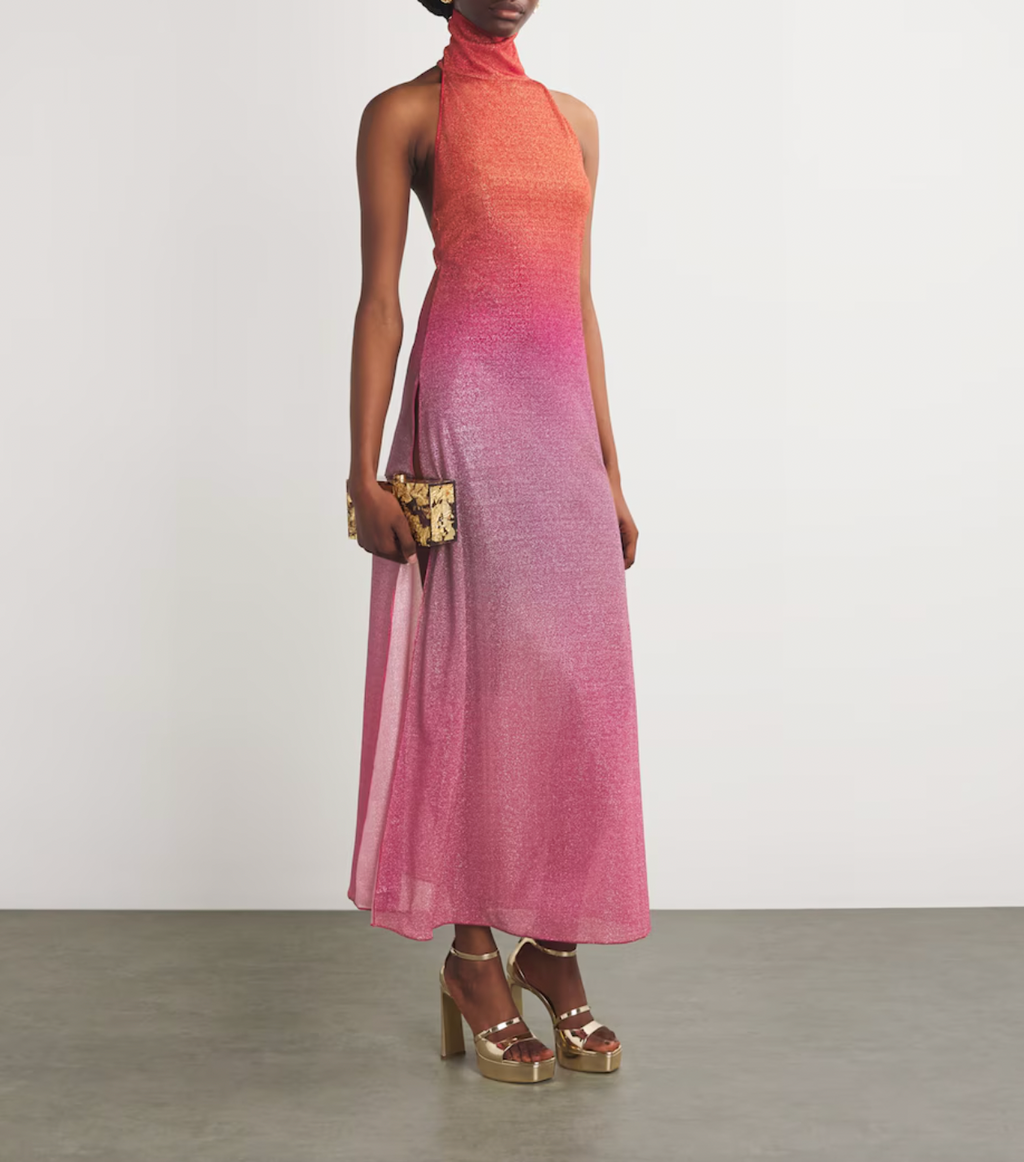 Experience elegance and modern sophistication with the OSÉREE Lumière Ombrè Metallic Stretch-Knit Halterneck Maxi Dress. Crafted from shimmering metallic stretch-knit fabric, this dress offers both comfort and a flattering fit that contours your silhouette. The ombrè effect adds depth and visual interest, while the halterneck design highlights the shoulders for a graceful, refined look. 