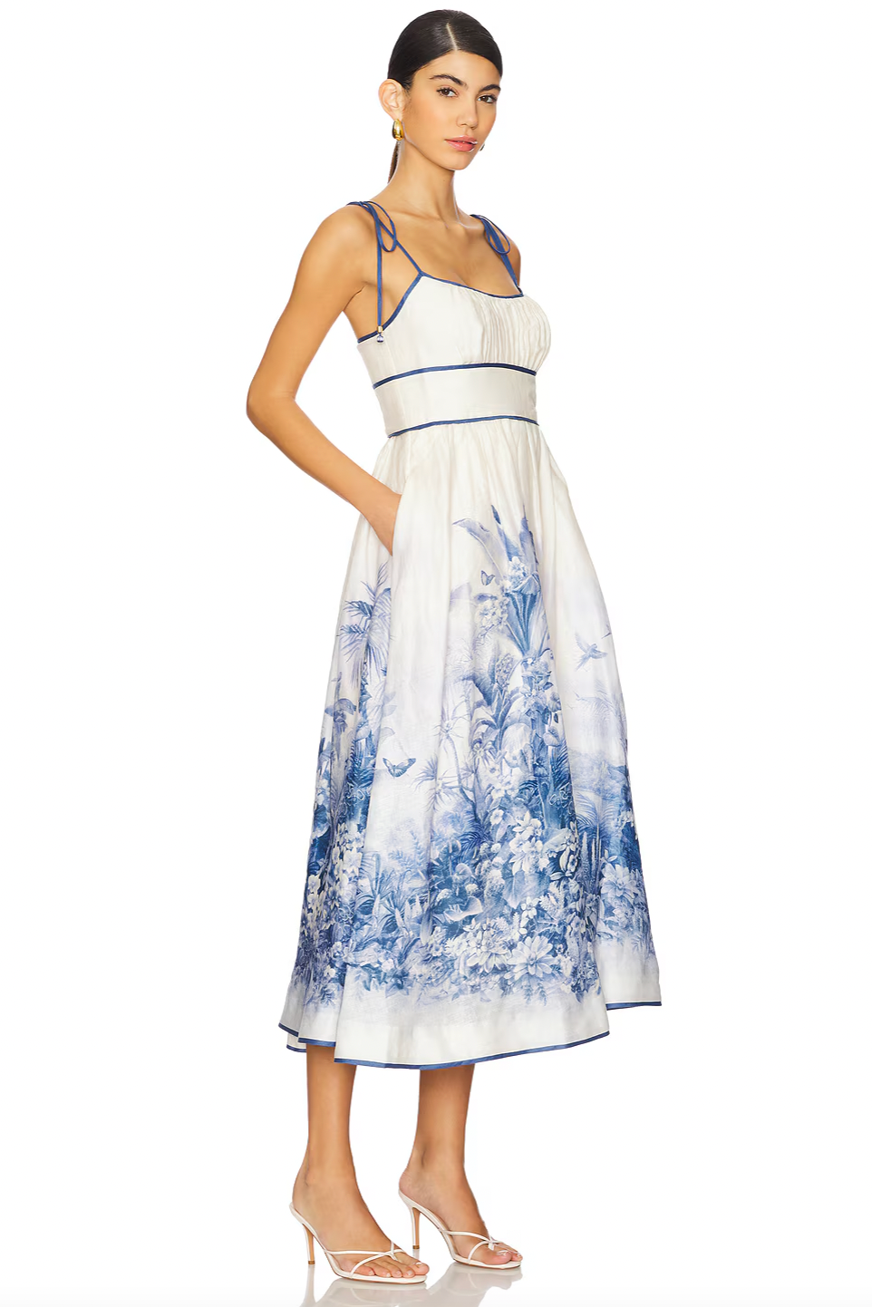 The Wylie Picnic Dress by Zimmermann features a lightweight, non-stretch linen weave ideal for breathable comfort. Its smocked elastic back panel ensures a tailored fit while maintaining ease of movement. Designed with a scoop neck for a classic silhouette, it secures discreetly with a hook-and-eye closure and hidden zip at the back. Practical on-seam side pockets add functionality without compromising style, making it a refined choice for warm-weather occasions.