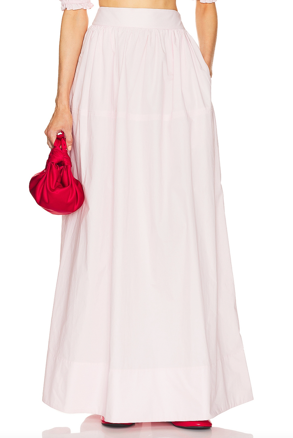 Crafted from 100% cotton lightweight poplin, this maxi skirt offers breathable comfort and a smooth drape. Designed with a hidden side zipper and side slip pockets, it combines practicality with a streamlined silhouette. The unlined construction enhances its light feel, making it ideal for warm weather wear. Note that this item is sold individually, allowing for versatile styling options. Machine washable for easy care, it delivers both function and refined simplicity.