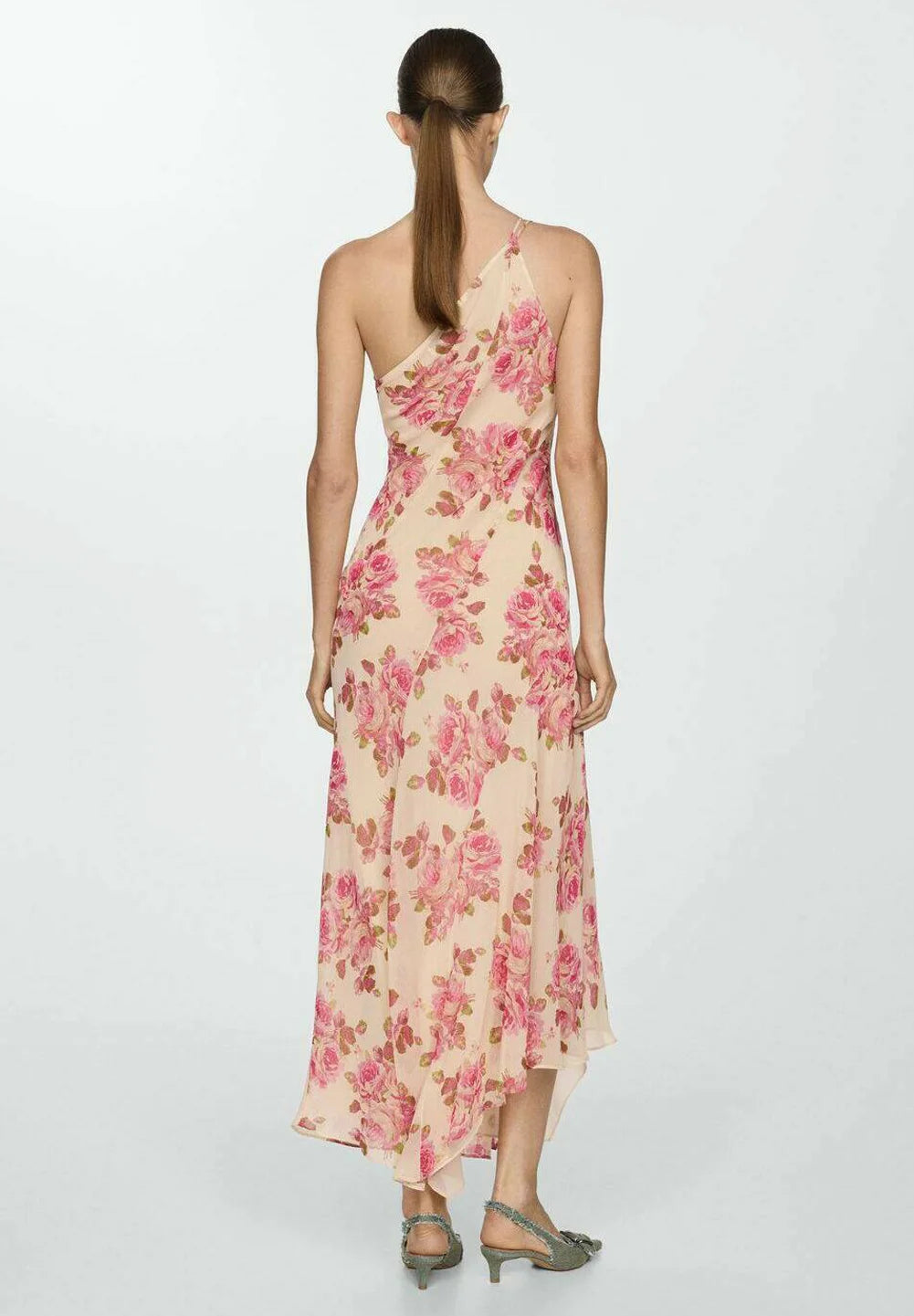 The Floral Slip Maxi Dress offers an elegant silhouette with its flowing maxi length and delicate floral pattern. Crafted for comfort and style, this dress features thin straps and a slip design that drapes gracefully over the body. Ideal for warm weather or layered in cooler seasons, it combines versatility with a timeless aesthetic perfect for both casual outings and special occasions.