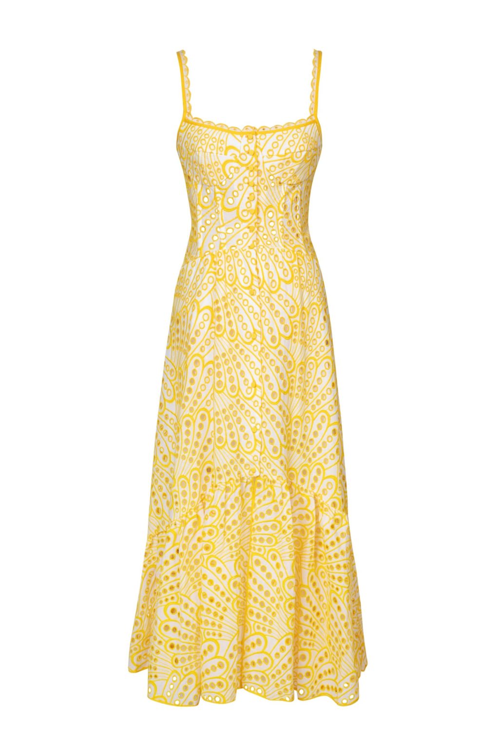 The Irene Dress by Charo Ruiz Ibiza features a front button design that allows for a full opening, enhancing ease and elegance. Crafted from partially lined embroidered batiste, it boasts a corseted bodice with a Balconette neckline that sculpts the silhouette. The dress culminates in a striking skirt, flowing into a dramatic ruffle made from the same delicate openwork fabric, combining structure with a graceful, airy finish.