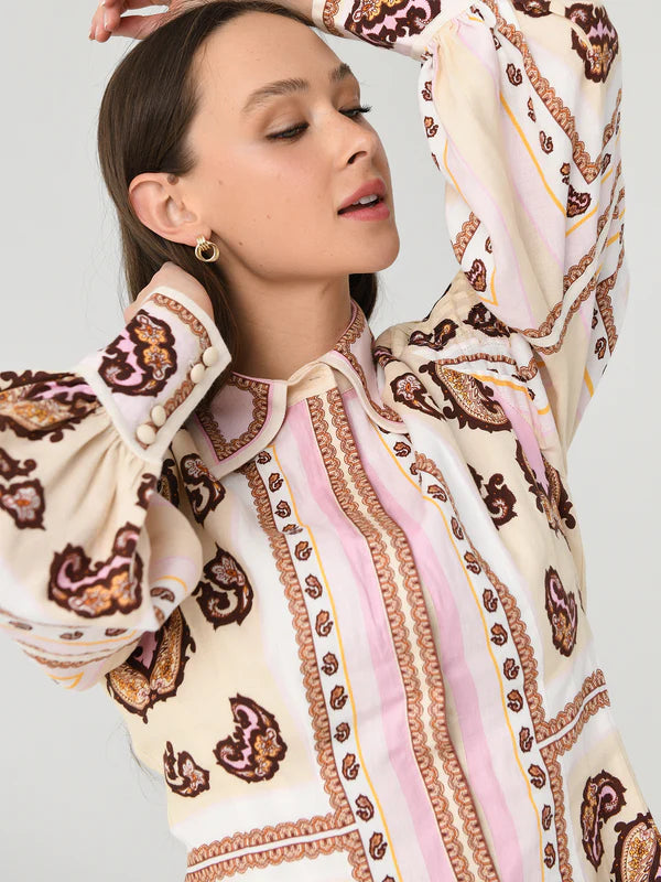 Experience a boost in your wardrobe with the Jagger Fitted Waist Mini Dress from Antipodean. Crafted with exquisite linen, it features a unique hand-drawn design and balloon sleeves for a flattering shape. Complete with a hidden placket, this dress is suitable for all occasions and a necessary addition to your closet.