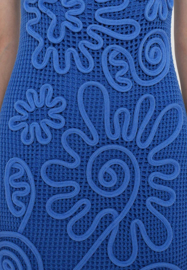 Elevate your wardrobe with the Nissa Dress in Capri by Cult Gaia, featuring a sophisticated sleeveless midi silhouette. Crafted with a delicate netting body, it is beautifully adorned with a detailed floral cord overlay for a refined texture and visual interest. Fully lined with a mini slip, this dress ensures comfortable coverage and ease of wear. Its effortless pull-on design offers convenience without compromising style, making it an ideal choice for elegant day or evening occasions.