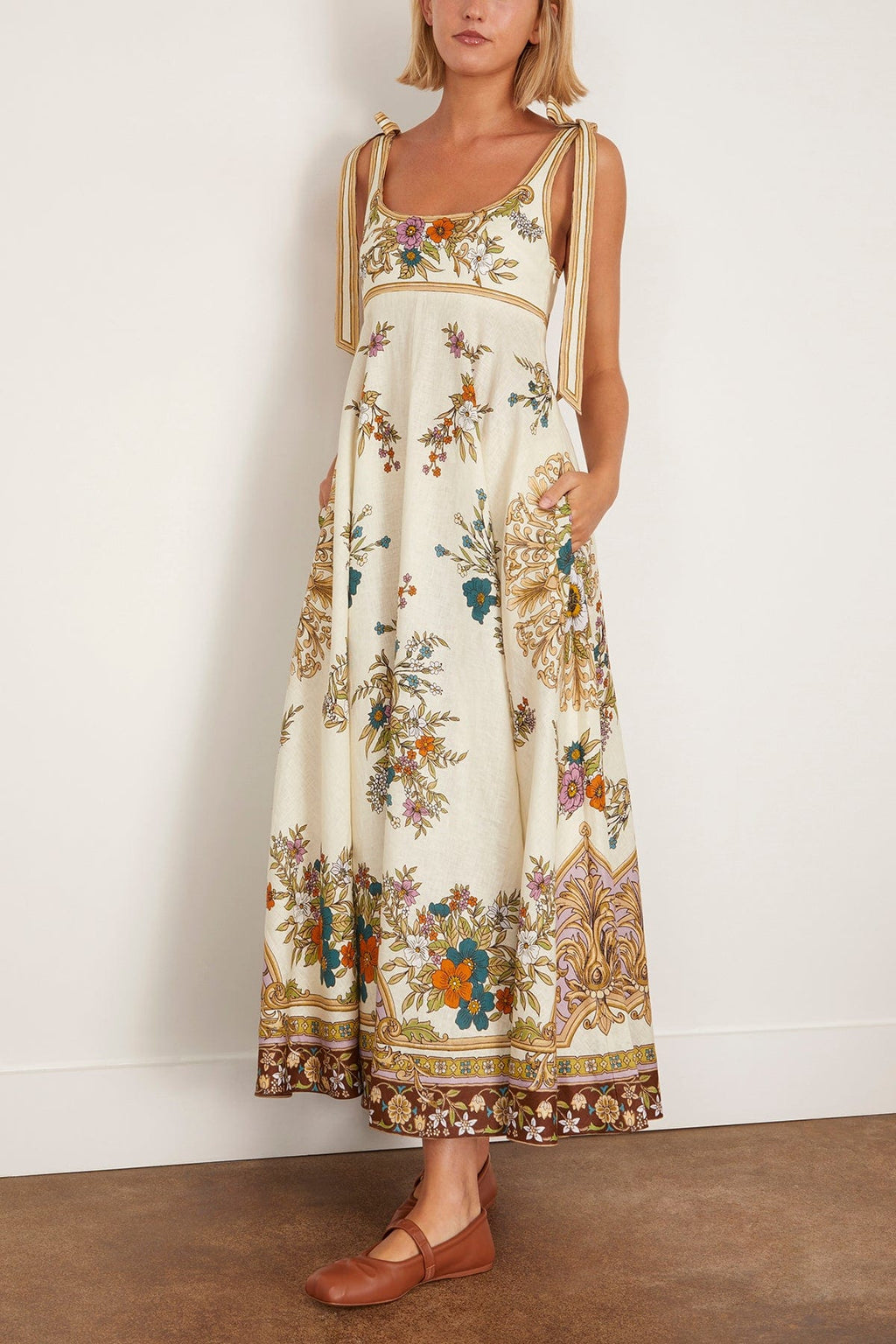 The Antoinette Ballet Sundress in Cream features Alemais’s standout print of the season, designed with an elegant empire waistline that flatters a variety of figures. Its midi length and full skirt create a graceful silhouette, while the shirred back and concealed zipper ensure a comfortable, seamless fit. Adjustable tie shoulders add a delicate touch, making this dress versatile for daytime outings when paired with flats and a tote. 