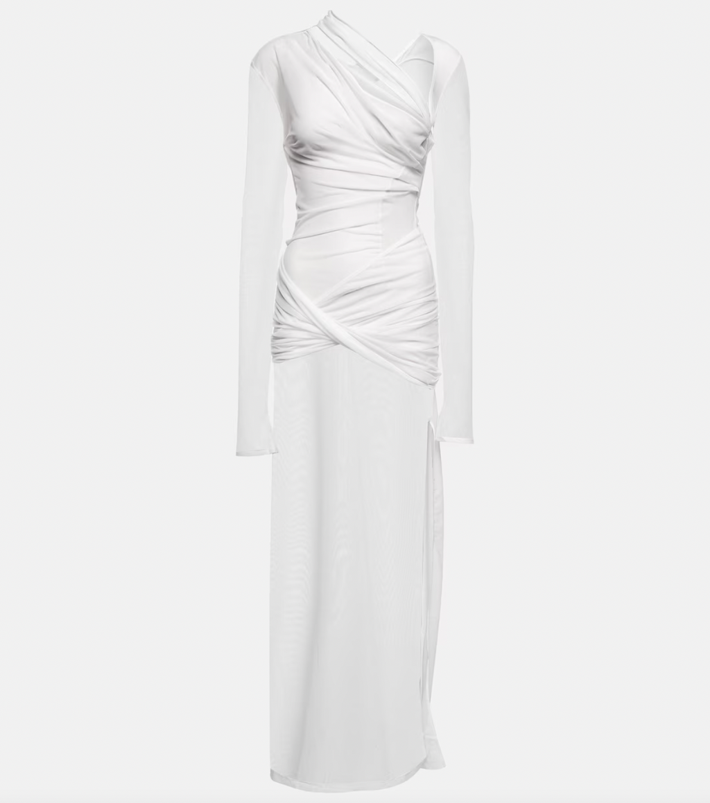 The La Robe Piombone tulle maxi dress by Jacquemus showcases a refined sheer tulle construction with a draped, full-length silhouette that elegantly contours the body. Its asymmetric neckline adds a modern architectural touch, while the long sleeves with thumb holes provide subtle coverage and a distinctive detail. The high-cut side slit enhances movement and introduces a sensual element, making this dress a sophisticated statement for formal occasions or avant-garde styling.