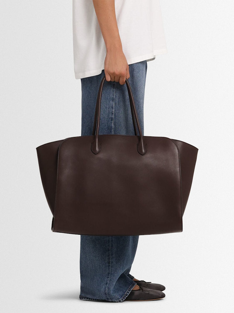 Crafted in Italy from 100% calf leather, the Marlo 17 Saddle Leather Tote Bag combines refined craftsmanship with practical design. Its chestnut hue complements double top handles for comfortable carrying, while a top toggle closure ensures secure access. The tote is lined and features an internal pocket to organize essentials, making it a sophisticated yet functional everyday accessory.