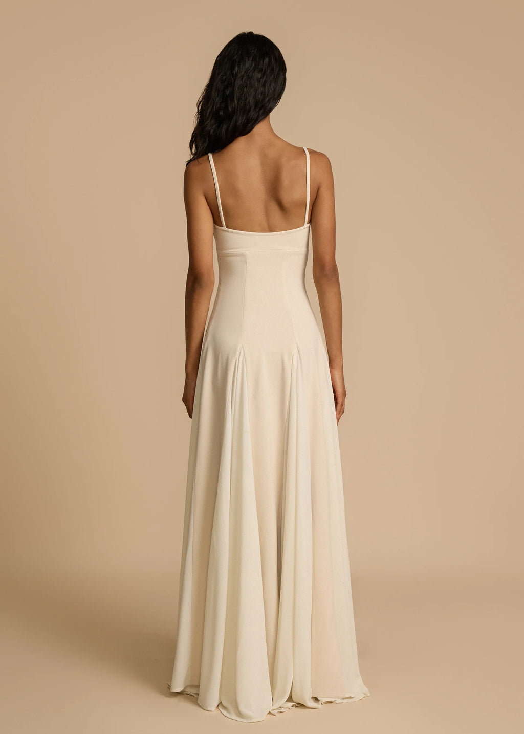 Paloma Dress by Arcina Ori combines classic elegance with modern design, featuring a paneled A-line skirt crafted from white georgette that drapes smoothly off the hips and moves gracefully. Its contrasting accents enhance fluidity, making it ideal for memorable occasions. Equipped with padded bra cups and binded edges, it offers structured support and a flattering silhouette. Paloma delivers refined sophistication and confidence from every perspective.